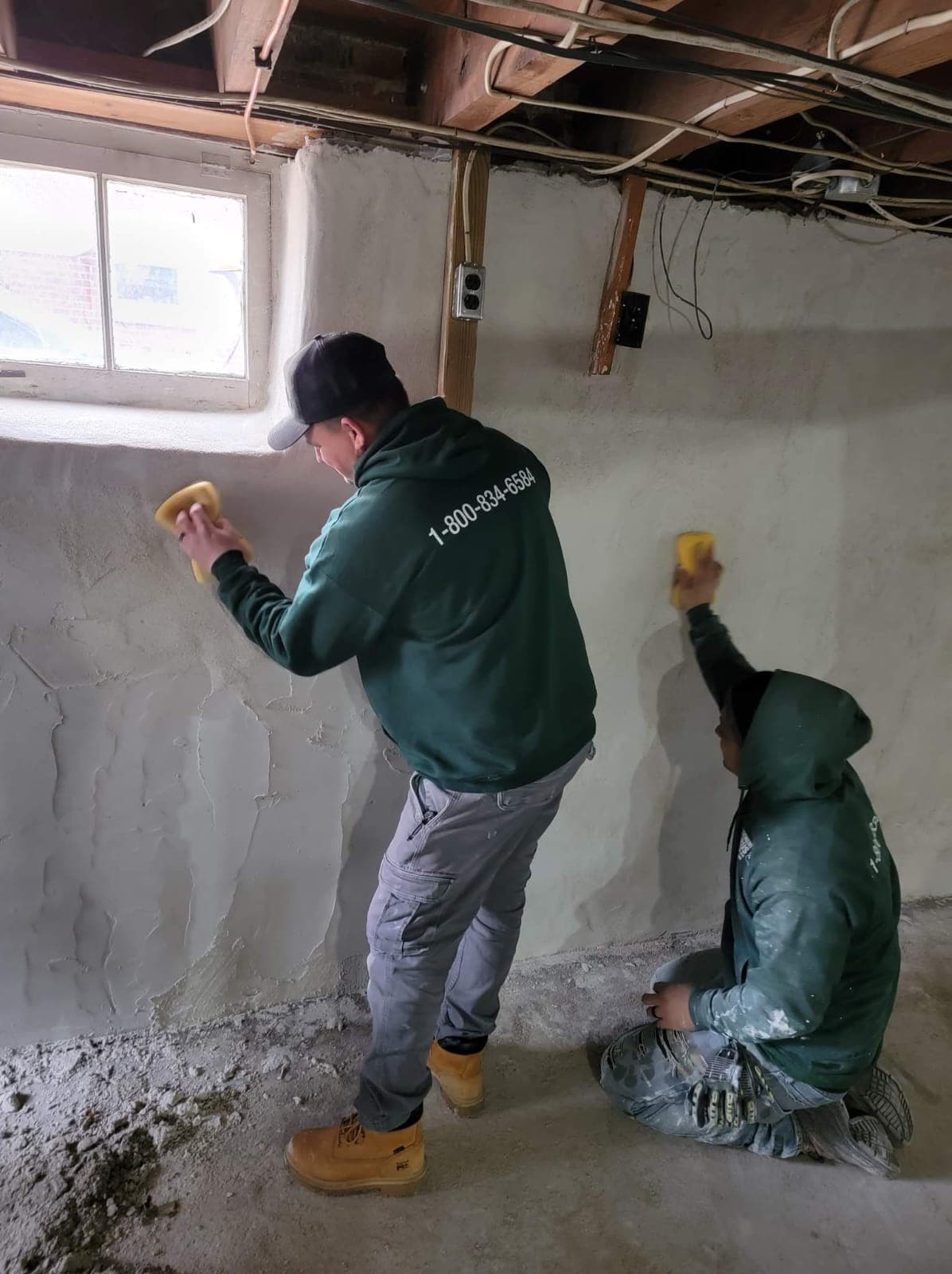 A Basement Gurus crew member working on a Lancaster County basement wall.